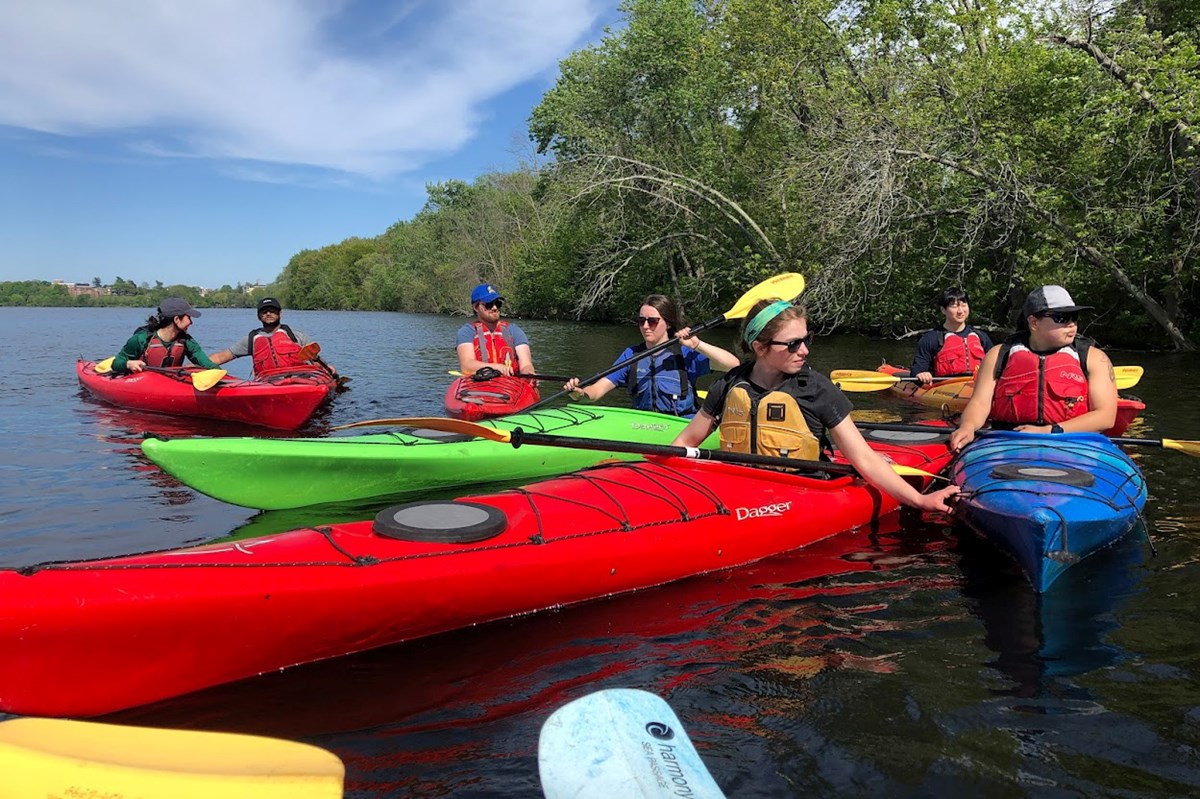 Student workers from UML Kayak Center on Merrimack River in Lowell.