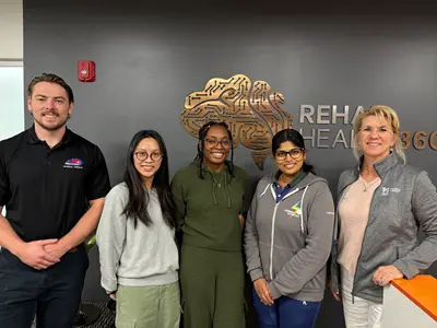 Physical Therapy and engineering students with Erika Lewis