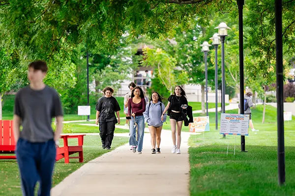 Photo shows students walking on UMass Lowell's campus.