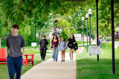 Photo shows students walking on UMass Lowell's campus.