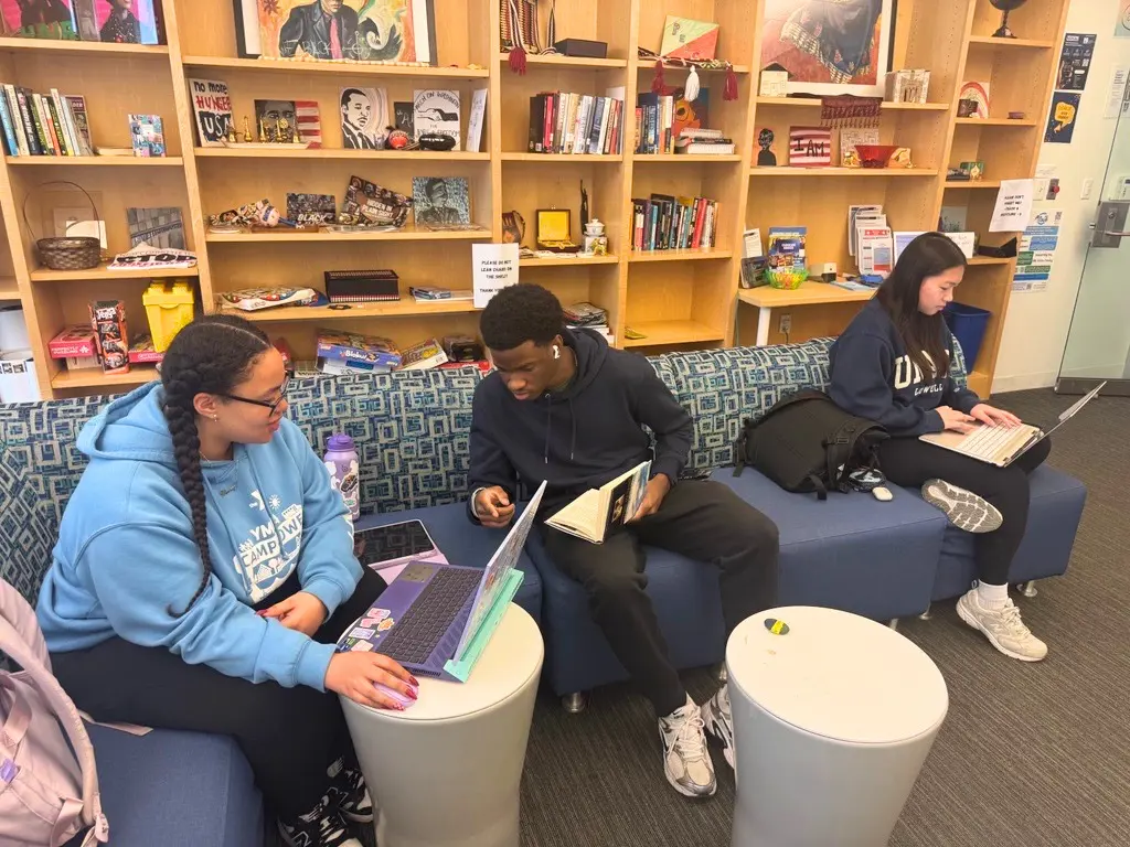 Three students studying in the Social Justice Center.