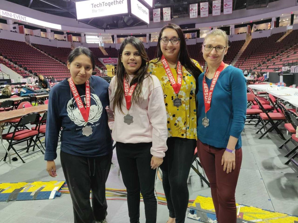 Surbhi Kanthed (center) and two other students pictured at Technica 2019, a hackathon.
