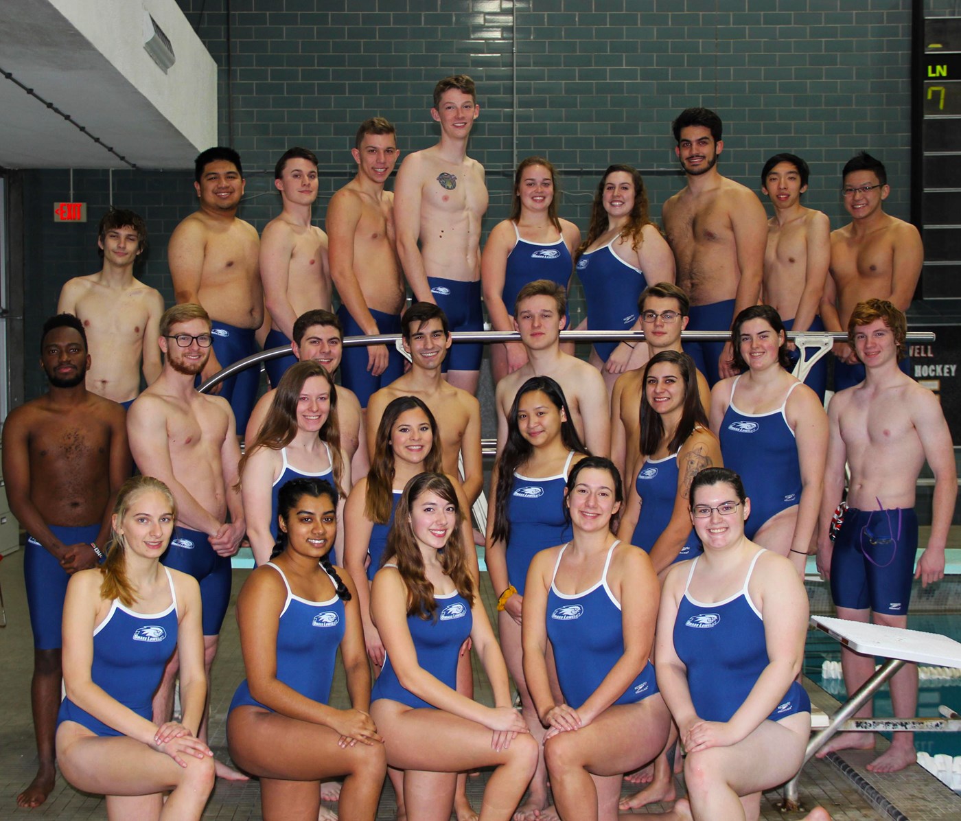 Swim and Dive team pose as a group prior to their meet