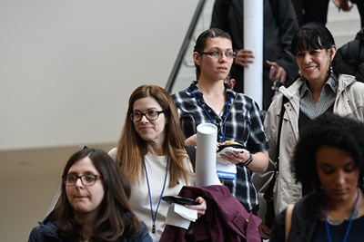 UMass Lowell Education Ph.D. student Yelenna Rondon waits on the stairs, just before learning she had won a prize for her research on community college students.