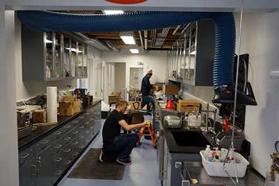 Workers set up a lab at TURI's new location  