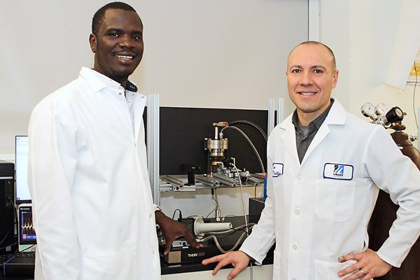 Assoc. Prof. Trelles and grad student in the lab