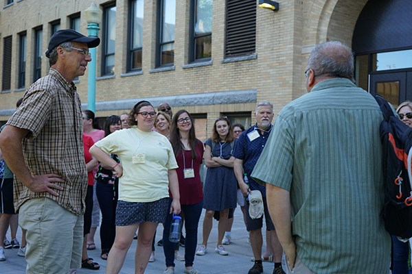 Lowell historians Gray Fitzsimons and David McKean take teachers on a walking tour of the Acre neighborhood as part of a National Endowment for the Humanities summer teacher institute