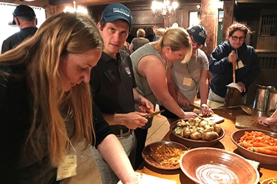 Teachers in a Tsongas Insdustrial History Center summer teacher institute make a hearth-cooked meal at Old Sturbridge Village