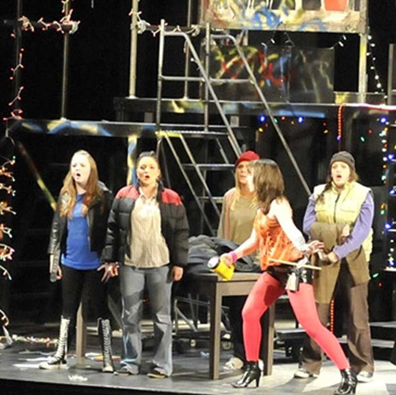 Students performing on stage for the Theatre Arts production of "Rent."