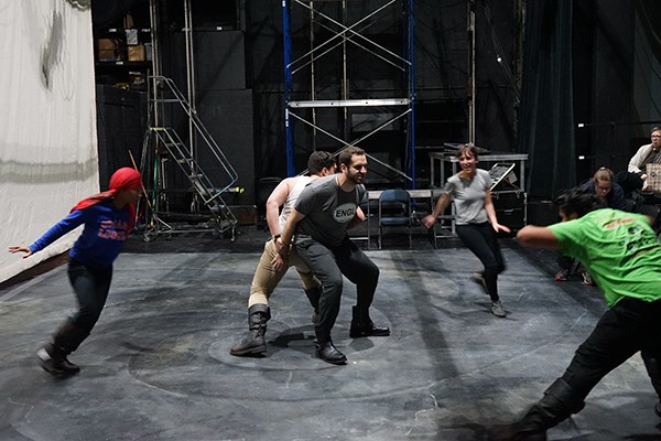 Nick Abourizk, as Macbeth, stands back to back with Fernando Barbosa, as Banquo, while the witches circle them during a technical rehearsal of "Macbeth" at UMass Lowell