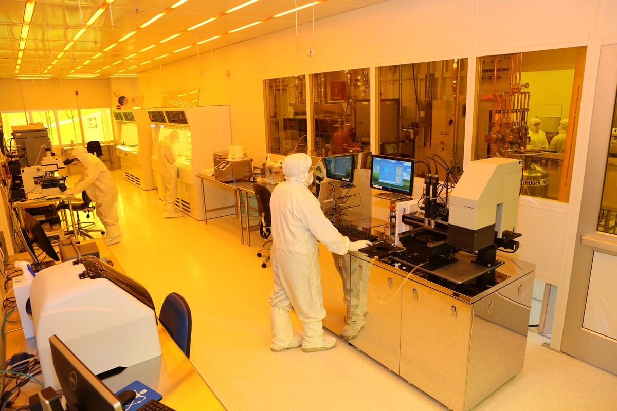 Worker in clean suit working in UMass Lowell's Nanofabrication Lab