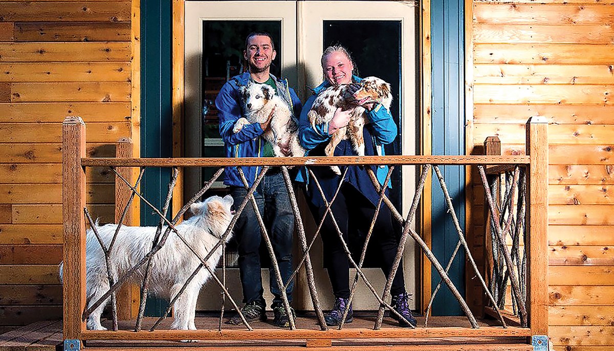Tiny house owners Luke and Tiny Orlando and their three dogs
