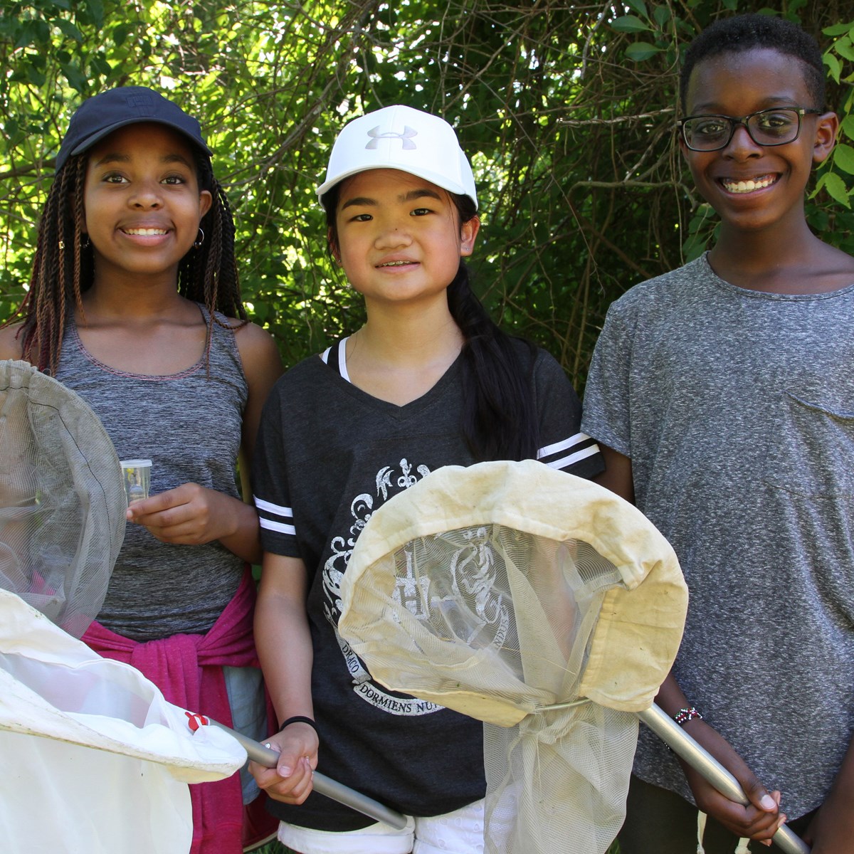School-age kids holding nets on a field trip with the Tsongas Industrial History Center