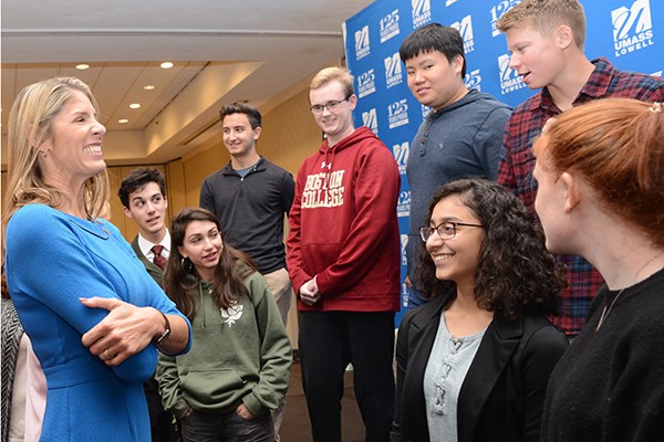 U.S. Rep. Lori Trahan speaks with Westford Academy high school students after the Parker Lecture at UMass Lowell