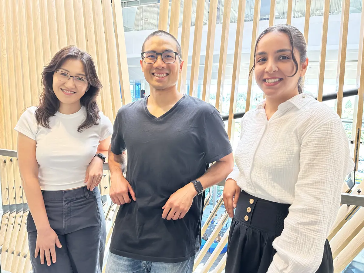 Lewis Tseng standing between two education Ph.D. students and research assistants, Youlim Lee and Negin Yazdani Motlagh.