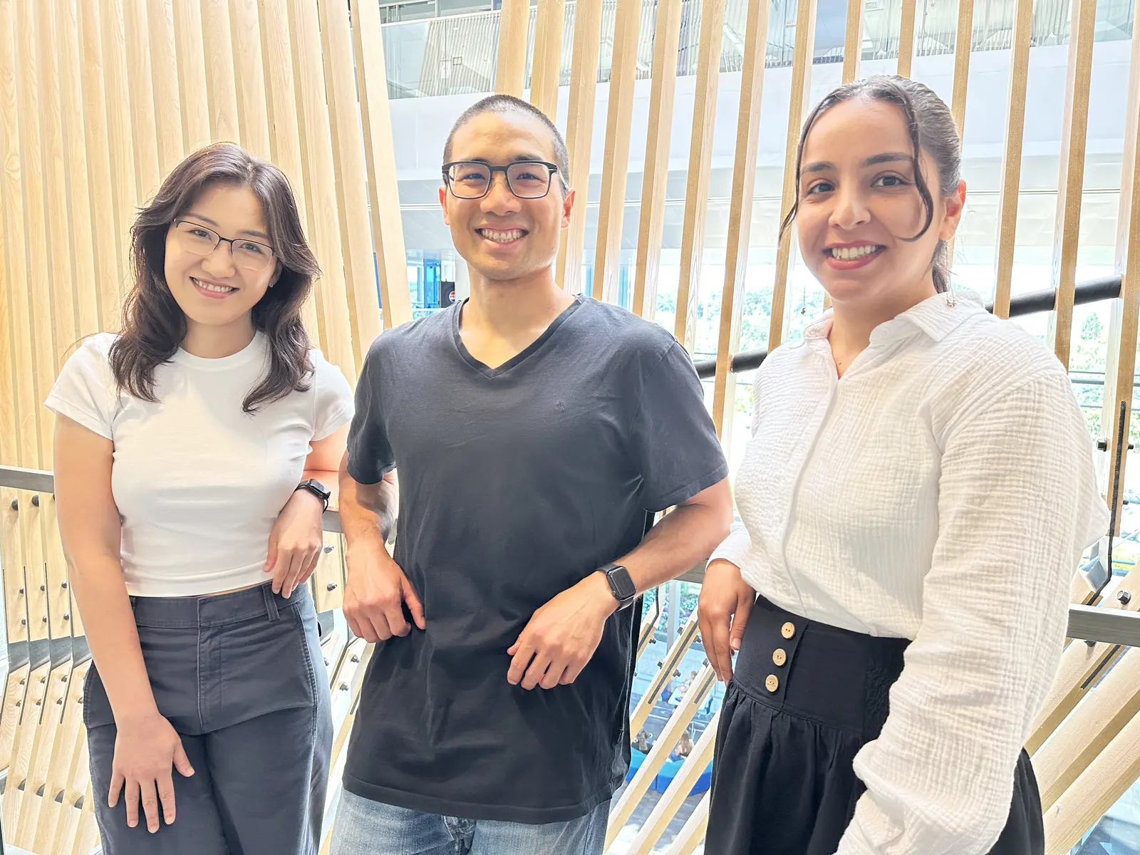 Lewis Tseng standing between two education Ph.D. students and research assistants, Youlim Lee and Negin Yazdani Motlagh.