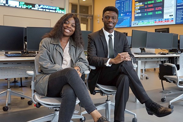 Brit and Easmond Tsewole in the business school's trading room