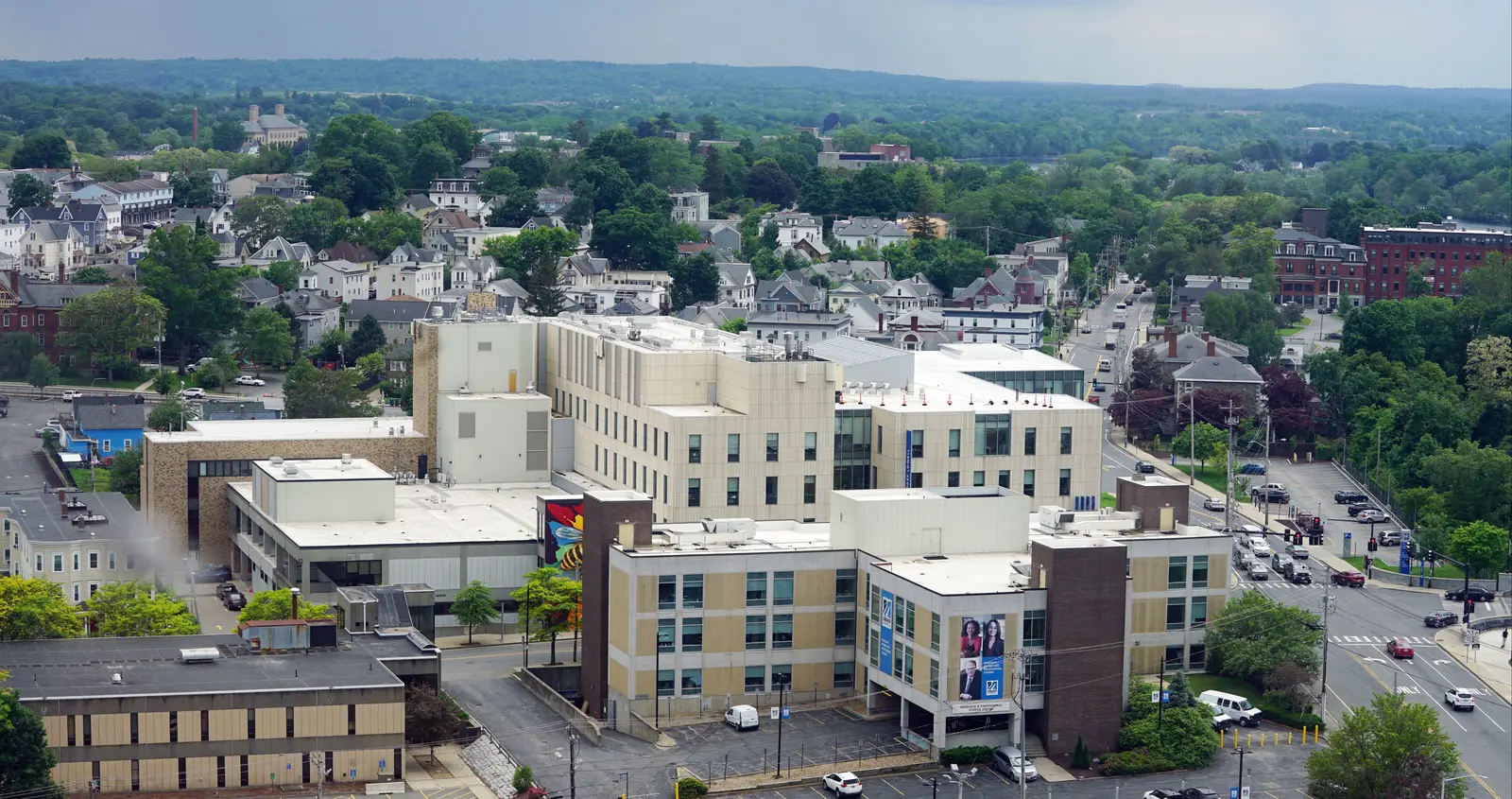 Aerial of the Graduate professional studies building with university crossing in the background