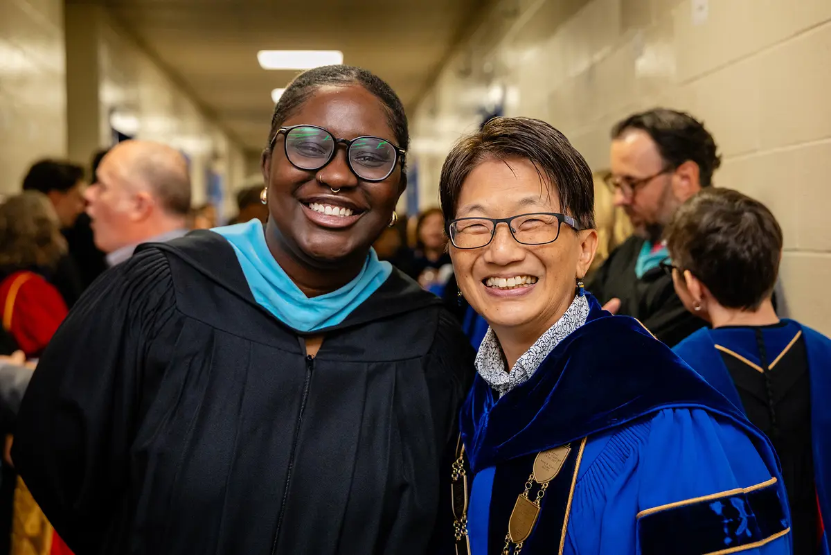 Chancellor Julie Chen smiles with Convocation speaker Dezanae Boston-Bernier.