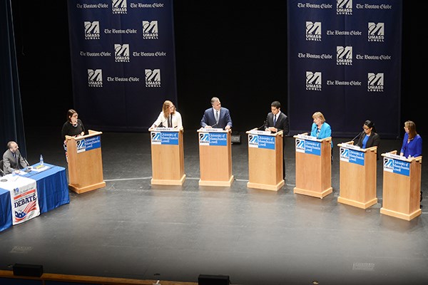 Candidates stand on the Durgin Hall stage during the second debate