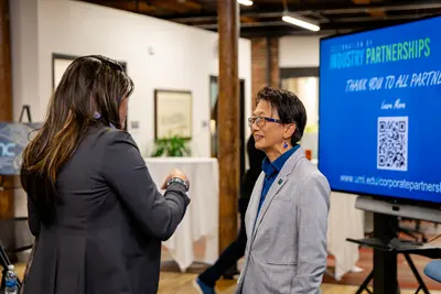 Yulisa Depena speaks with Chancellor Julie Chen.