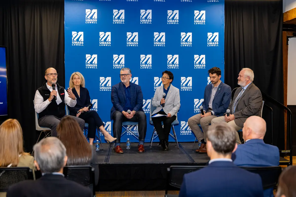 Six people sit on a panel at the Celebration of Industry Partnerships event.