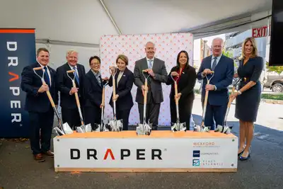 Officials hold shovels at the ceremony groundbreaking of a Draper facility.