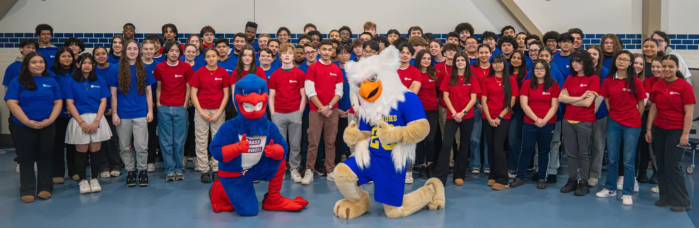 Early College students pose with UMass Lowell and Greater Lowell Technical High School mascots.