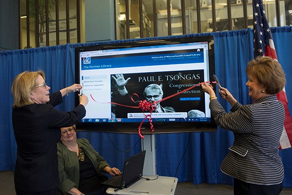 Niki Tsongas and Jacquie Moloney cut the ribbon on Tsongas Collection