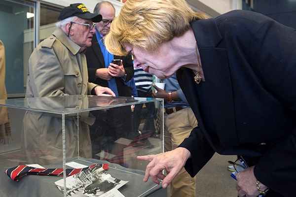 Niki Tsongas looks at a collection of Paul Tsongas items