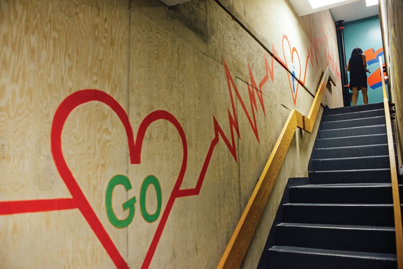 Mural of heart and EKG line in the central stairwell of O'Leary Library
