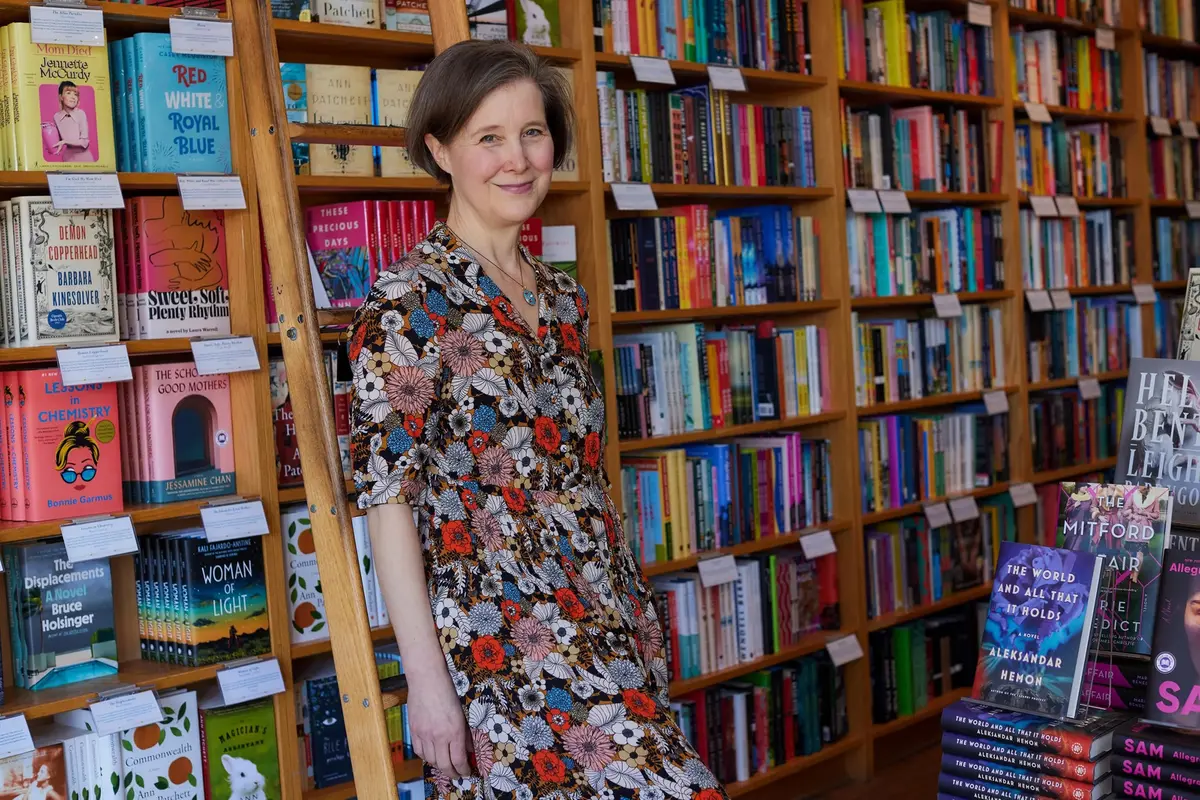 Author Ann Patchett in front of  book stacks at her bookstore in Tennessee.