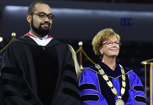 Chancellor Jacquie Moloney, right, with speaker Benjamin O'Keefe at Convocation 2017