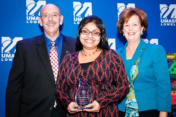Asst. Prof. Urmitapa Dutta receives the 2015 Martin Luther King Award for Distinguished Service from Larry Siegel, Associate Vice Chancellor of Student Affairs, and then-Executive Vice Chancellor Jacquie Moloney.