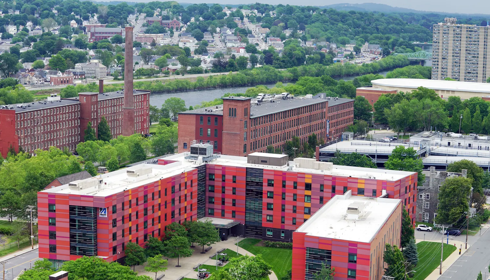 aerial of university suites building with mills in background