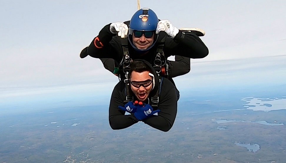 Victor Souza skydiving with a friend