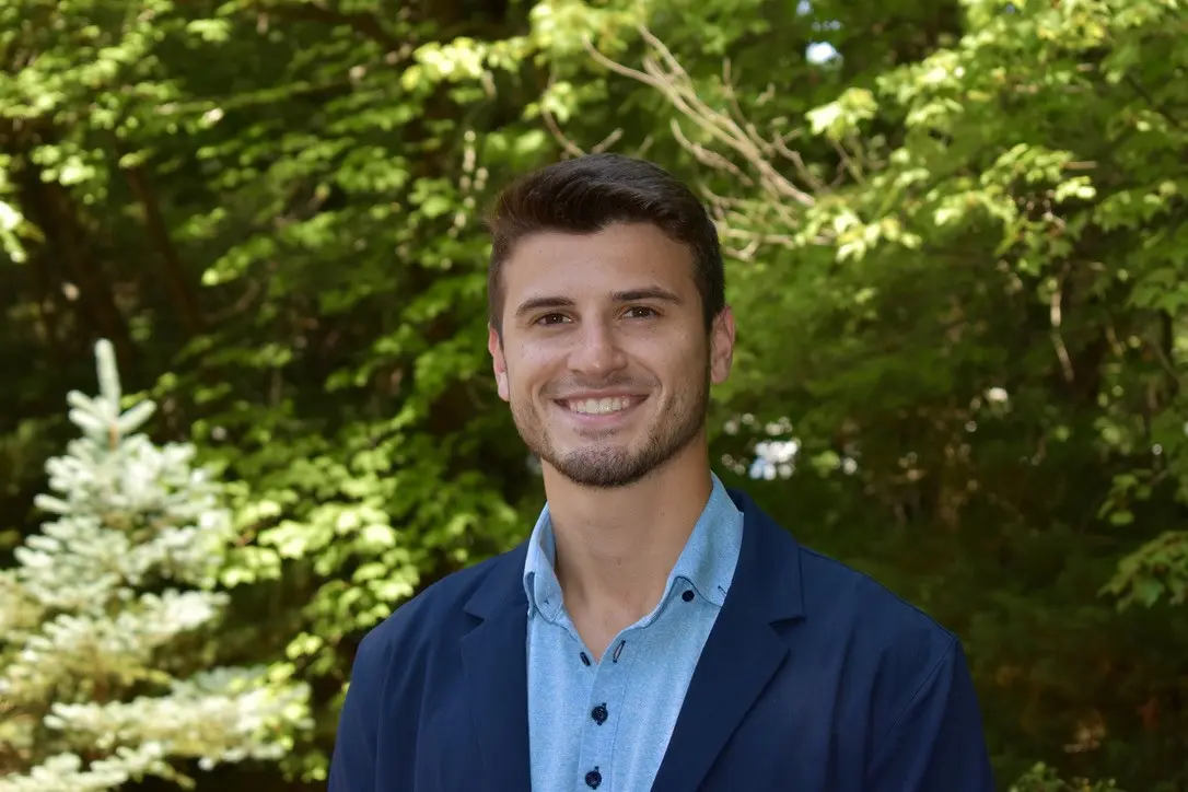 Team Leader, Alexander Frawley, Business Administration student smiling for the camera.