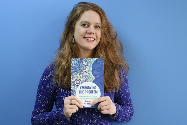 UMass Lowell Asst. Prof. of English Jenna Vinson with her new book, "Embodying the Problem"