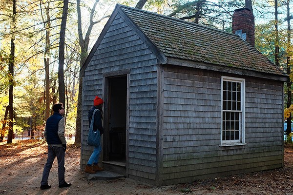 Honors College students visit a replica of Thoreau's cabin near Walden Pond.