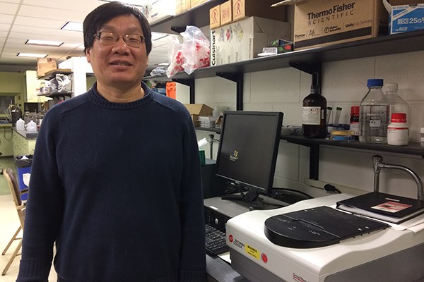 Chemistry Prof. Yuyu Sun in his laboratory