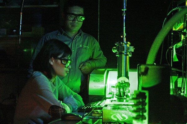 Prof. Xuejun Lu and his student working in the lab