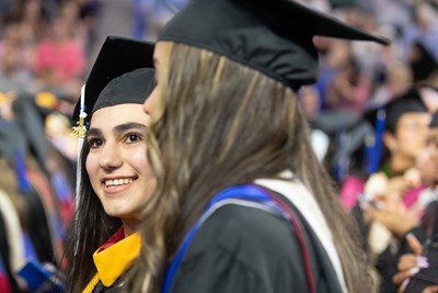 UMass Lowell student beams during graduation exercises
