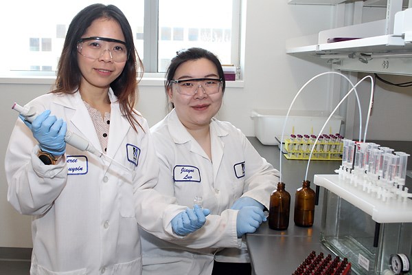 Civil and Environmental Engineering Asst. Prof. Sheree Pagsuyoin with graduate student Jiayue Luo in the lab in January.