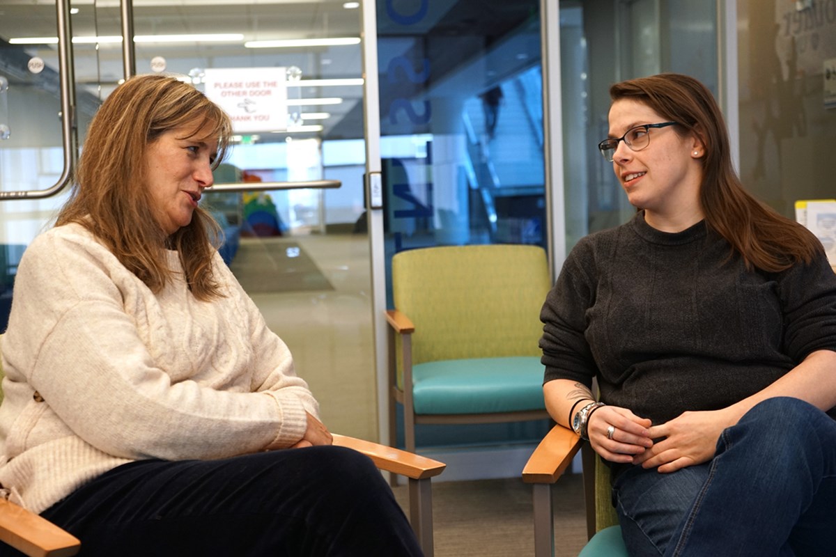 Abigail Lipski talks to a staff member at UML's Disability Services