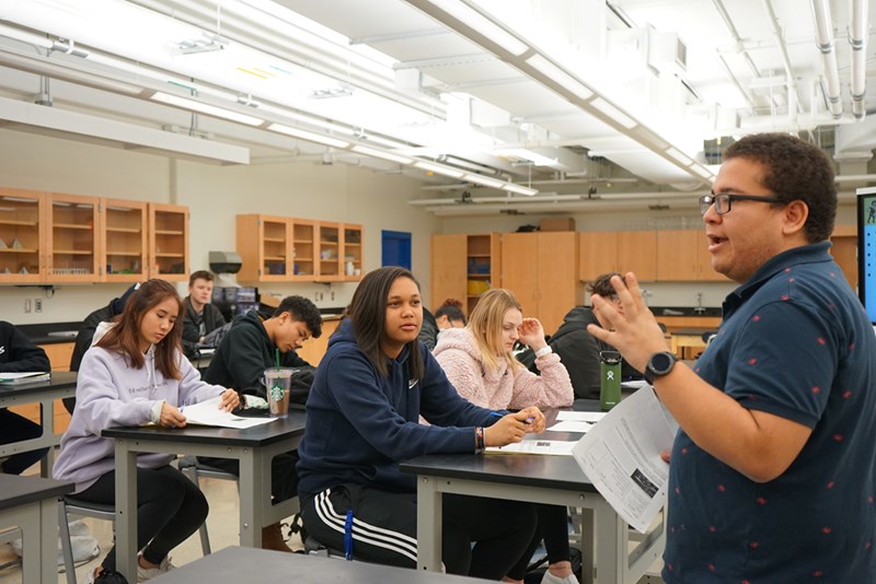 Alex Eden teaches biology to a group of students in his classroom at Greater Lowell Technical High School