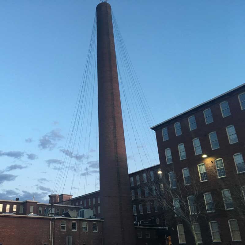 Mill building and smokestack in Lowell, Massachusetts