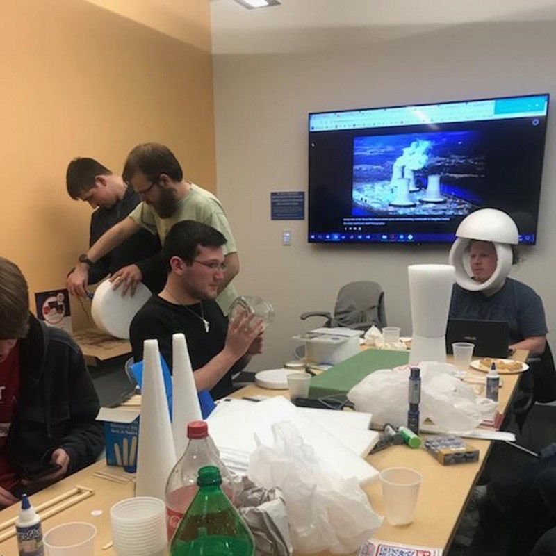 Members of the UMass Lowell student group - American Nuclear Society (ANS) UMass Lowell Chapter working on building a foam reactor model.