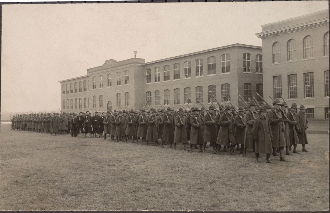Army recruits march outside of Kitson Hall, 1918