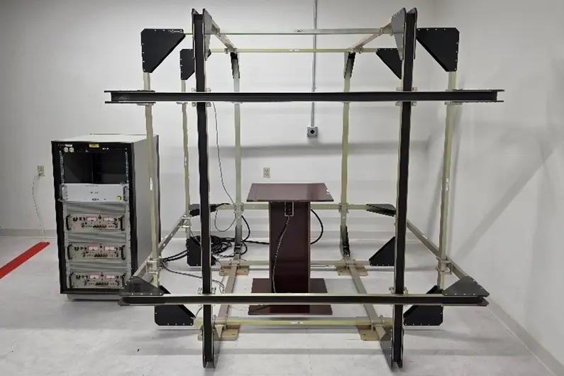 Attitude Control System Testing Facility with table with wires and scaffolding around it