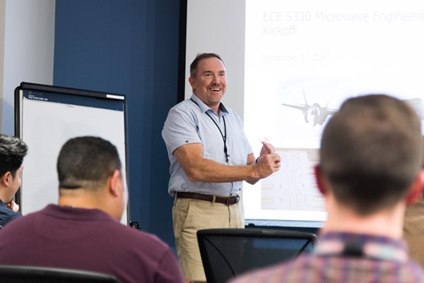 BAE executive Ray Brousseau ’86 speaks to students in the UML graduate certificate course in microwave engineering, taught on the BAE Systems campus.